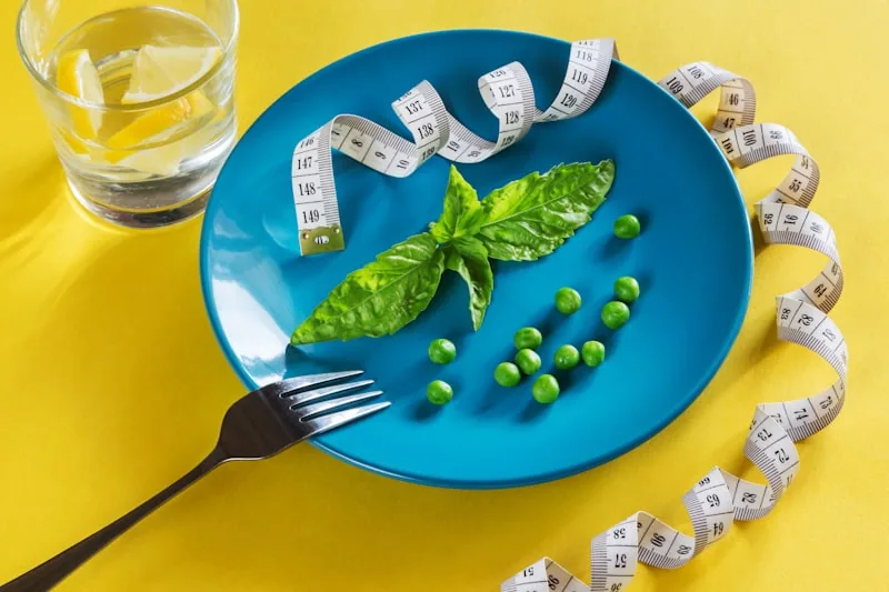 Healthy alkaline meal with a measuring tape — simple weight-loss nutrition