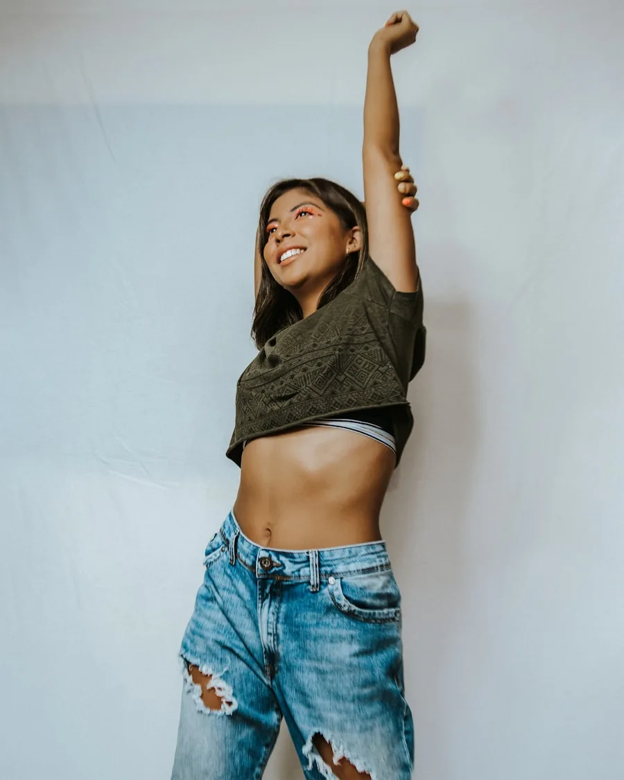 Happy, slim woman celebrating her weight-loss results